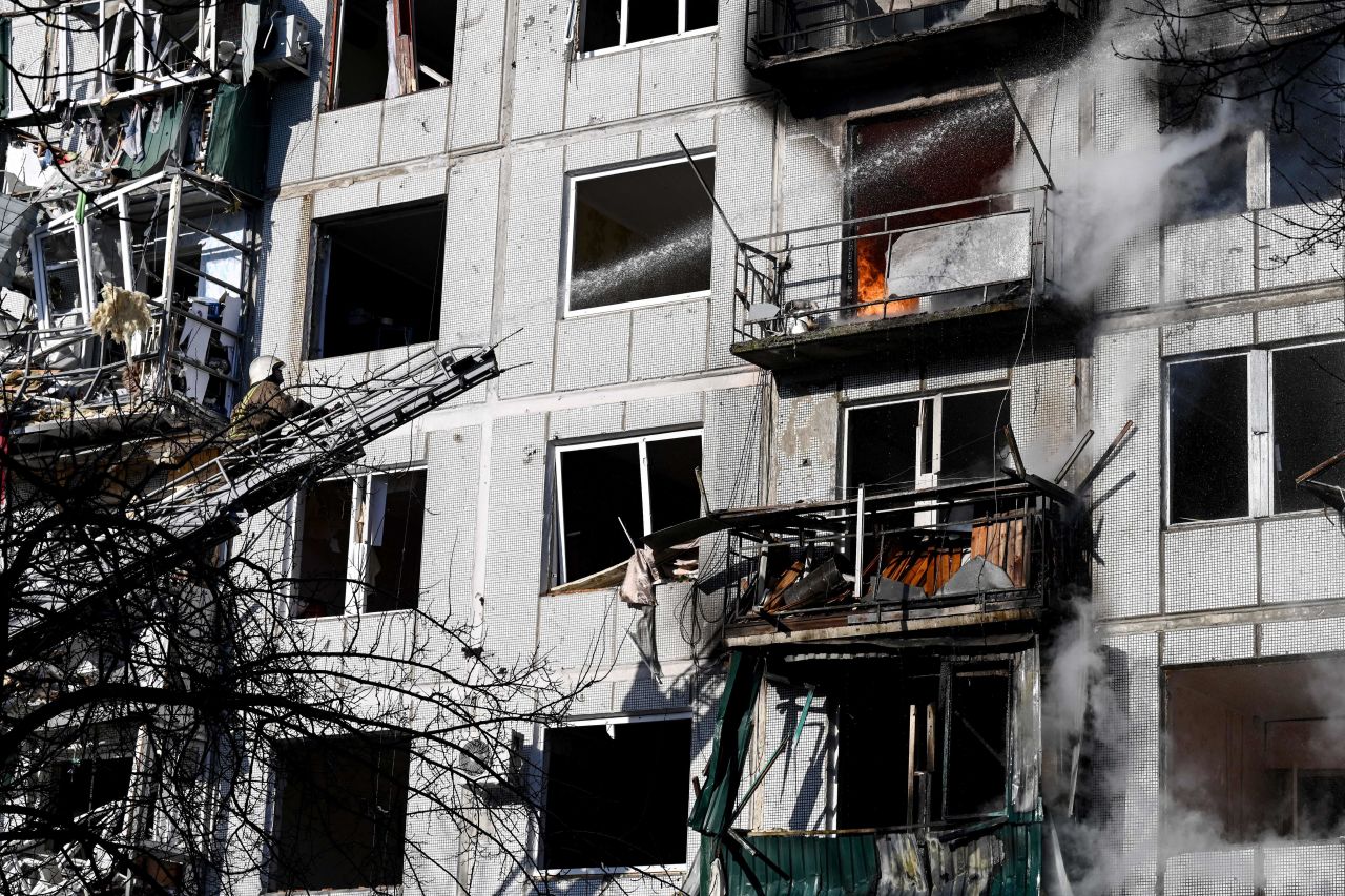 Firefighters work on a fire on a building after bombings on the eastern Ukraine town of Chuguiv, Ukraine, on February 24.
