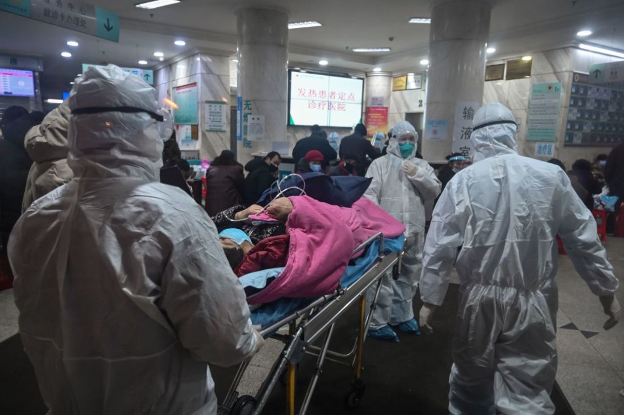 Medical staff arrive with a patient at the Wuhan Red Cross Hospital?last month.