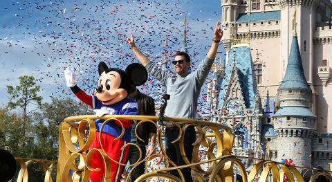Super Bowl LIII winning quarterback Tom Brady of the New England Patriots celebrates with Mickey Mouse in the Super Bowl victory parade in the Magic Kingdom at Walt Disney World, in Lake Buena Vista, Florida, on February 4, 2019.