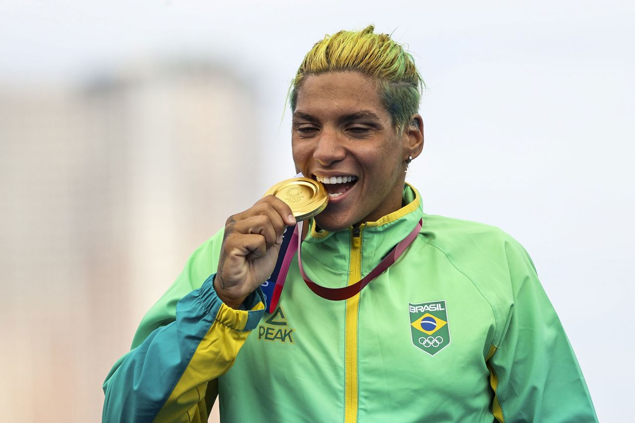 Ana Marcela Cunha of Brazil celebrates her gold medal win in the 10 kilometer swimming event on August 4.