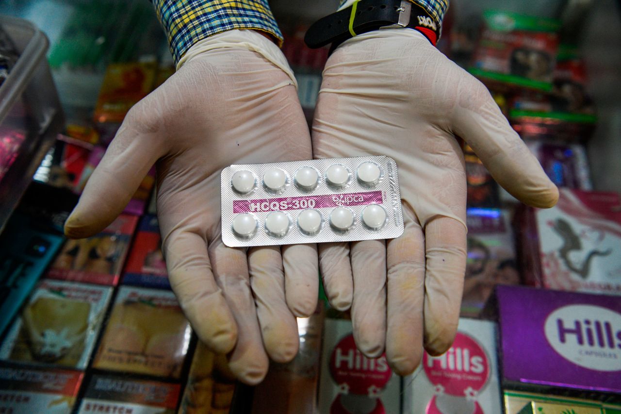 A vendor displays hydroxychloroquine (HCQ) tablets at a pharmacy in New Delhi, India.