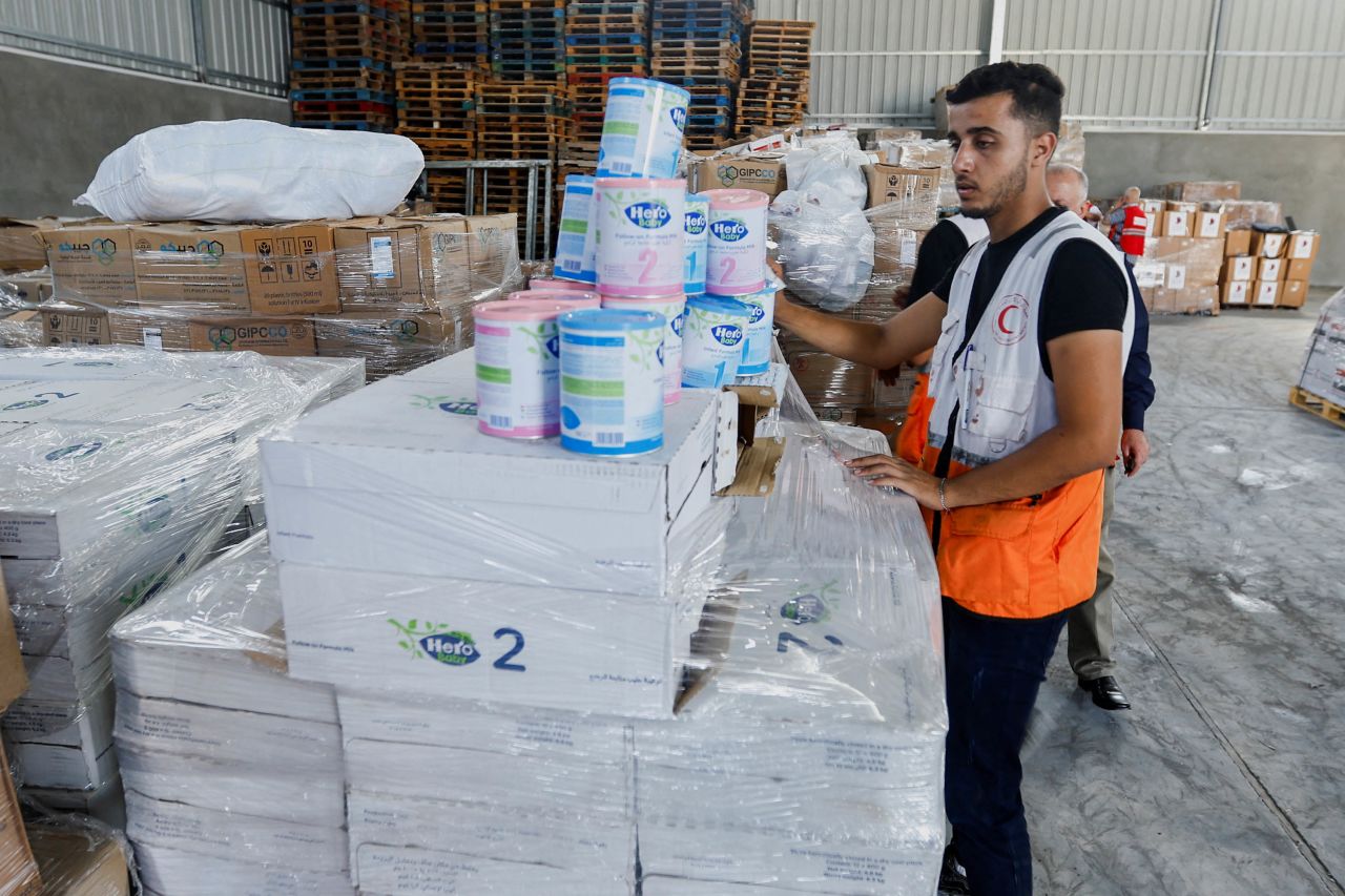 A Red Crescent worker sorts aid before it's distributed to Palestinians, in Khan Younis, Gaza, on October 23. 