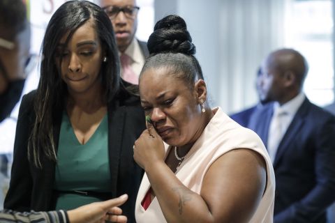 Tomika Miller, center, widow of Rayshard Brooks, cries as she leaves a news conference in Atlanta, Georgia, on Wednesday, June 17. 