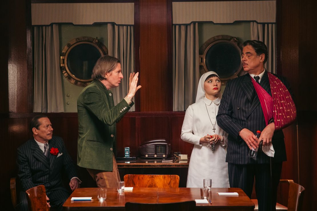 Mathieu Amalric, Wes Anderson, Mia Threapleton and Benicio Del Toro in a behind-the-scenes shot during the production of 