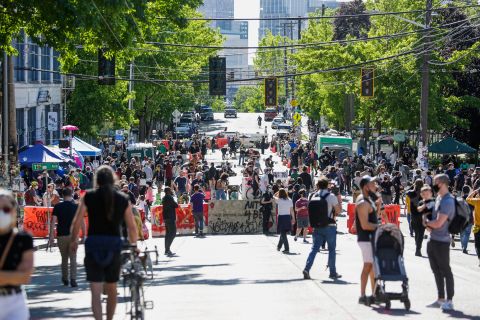 People walk around the "Capitol Hill Autonomous Zone," on June 11 in Seattle, Washington.
