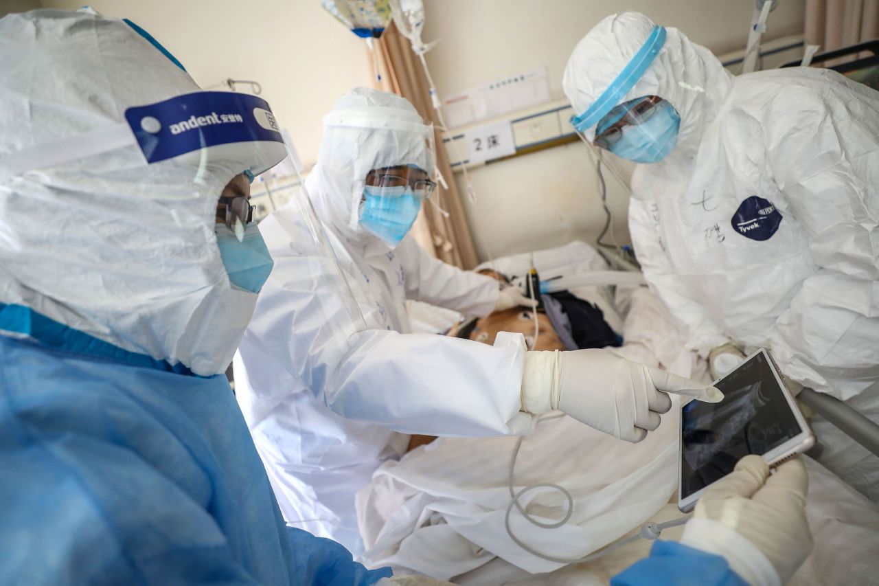 Doctors treat a patient for coronavirus at the Wuhan Red Cross Hospital on February 16. 