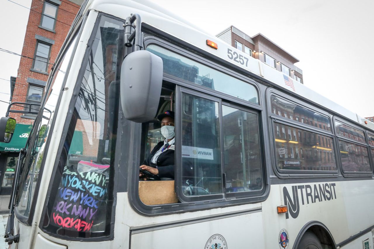 A NJ Transit bus driver wears a mask on April 27 in Jersey City, New Jersey.