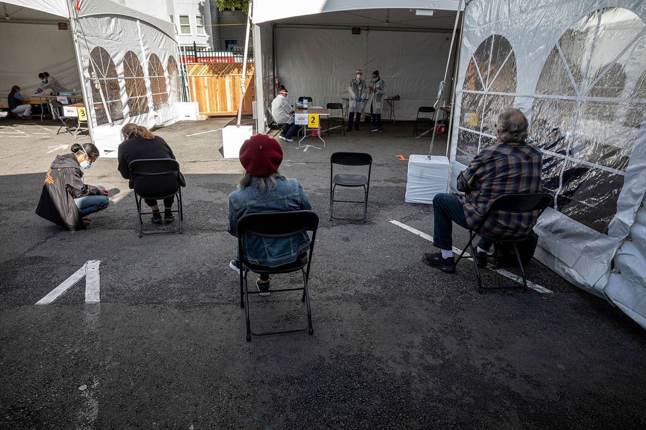 People wait in an observation area after receiving the Moderna Covid-19 vaccine at a vaccination site in San Francisco, California, on Wednesday, February 3.