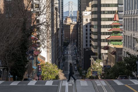 A pedestrian crosses the street in San Francisco on December 29.