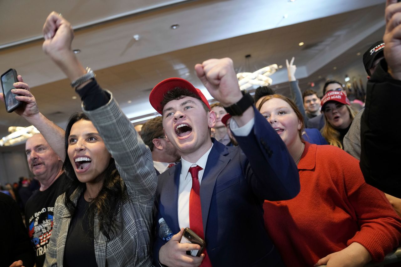 Supporters of Republican presidential candidate former President Donald Trump cheer at an election night rally in Nashua on Tuesday.