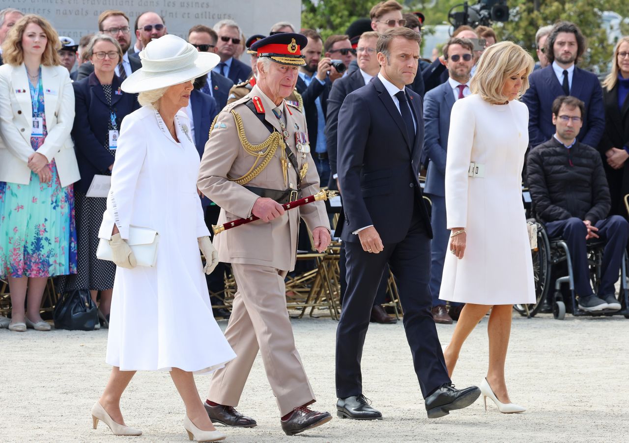 Left - to right, Queen Camilla, King Charles III, President of France, Emmanuel Macron and Brigitte Macron attend the UK Ministry of Defence and the Royal British Legion’s commemorative event at the British Normandy Memorial to mark the 80th anniversary of D-Day on June 6,  in Ver-Sur-Mer, France. 