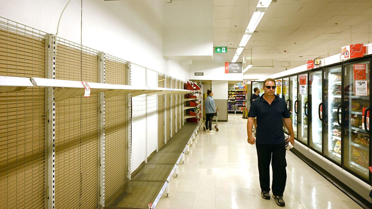 Shelves are empty of toilet rolls in a supermarket in Sydney on March 4. 