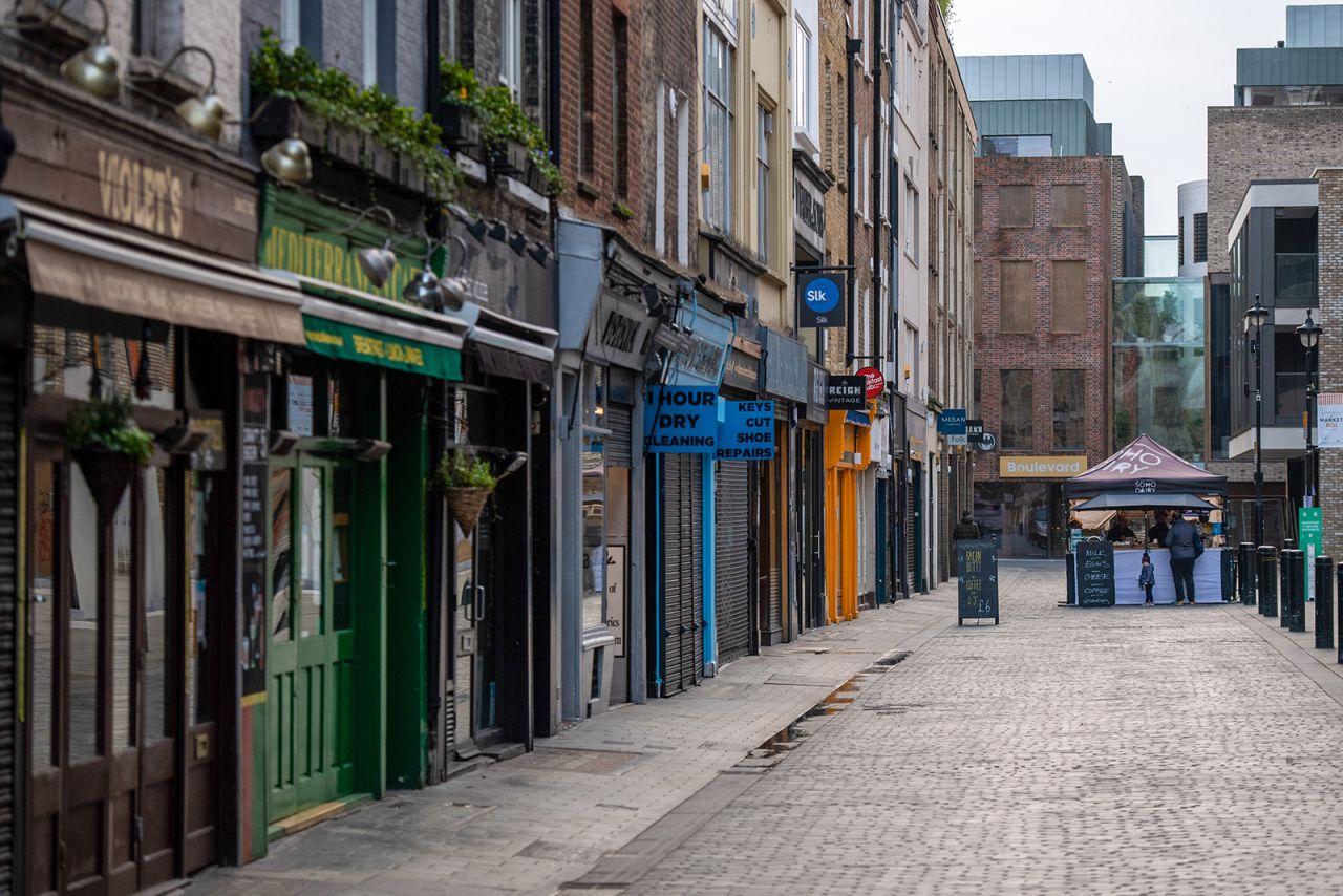 A stall sells coffee and food on a quiet street with closed shops in Soho, central London, on January 15.