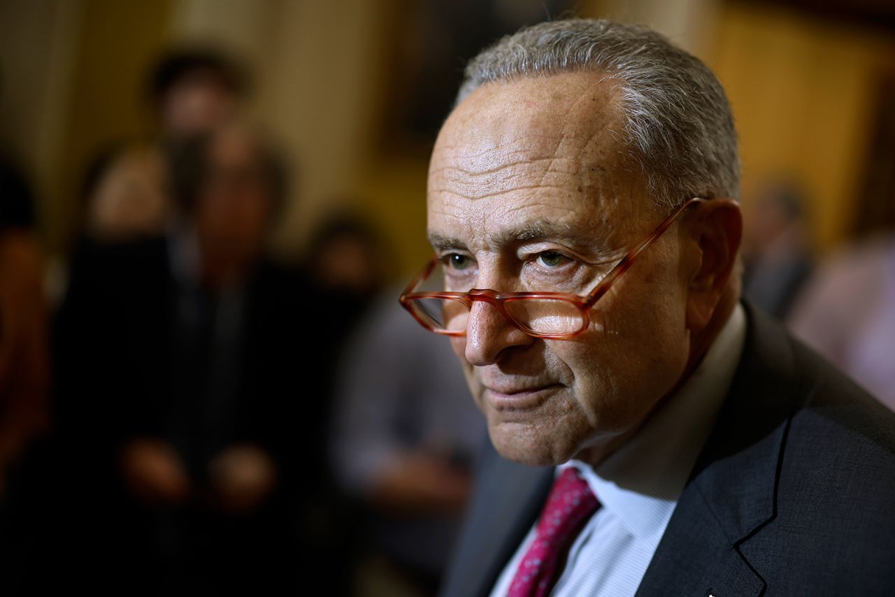 Senate Majority Leader Chuck Schumer talks to reporters on October 4, in Washington, DC. 