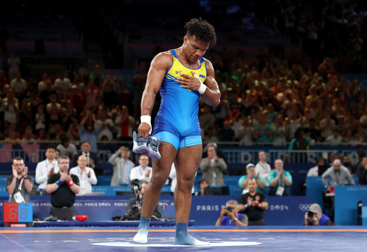 Ukrainian wrestler Zhan Beleniuk reacts after winning a bronze medal on August 8.