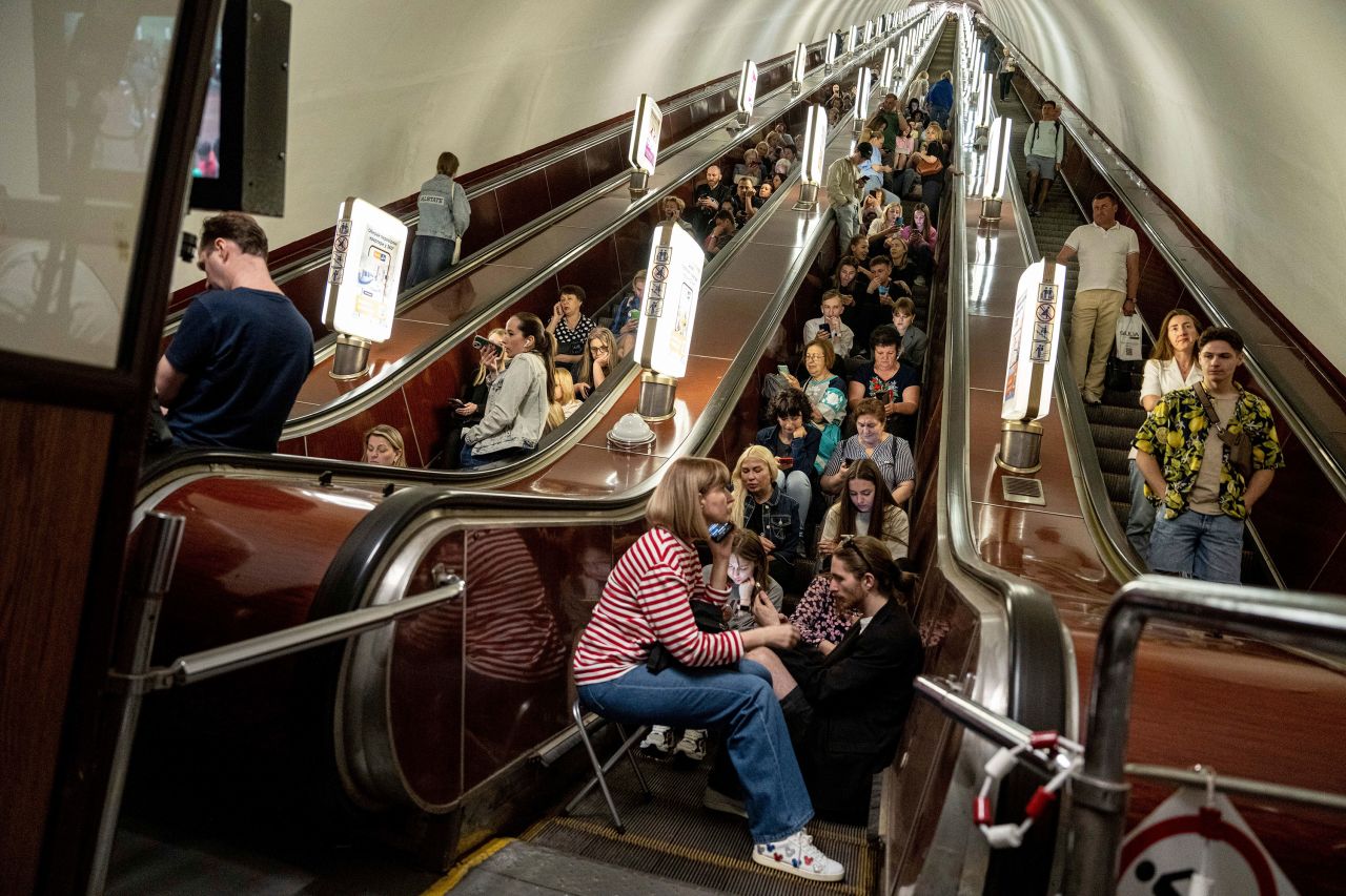 People take cover inside a train station during a rocket attack in Kyiv on Monday.