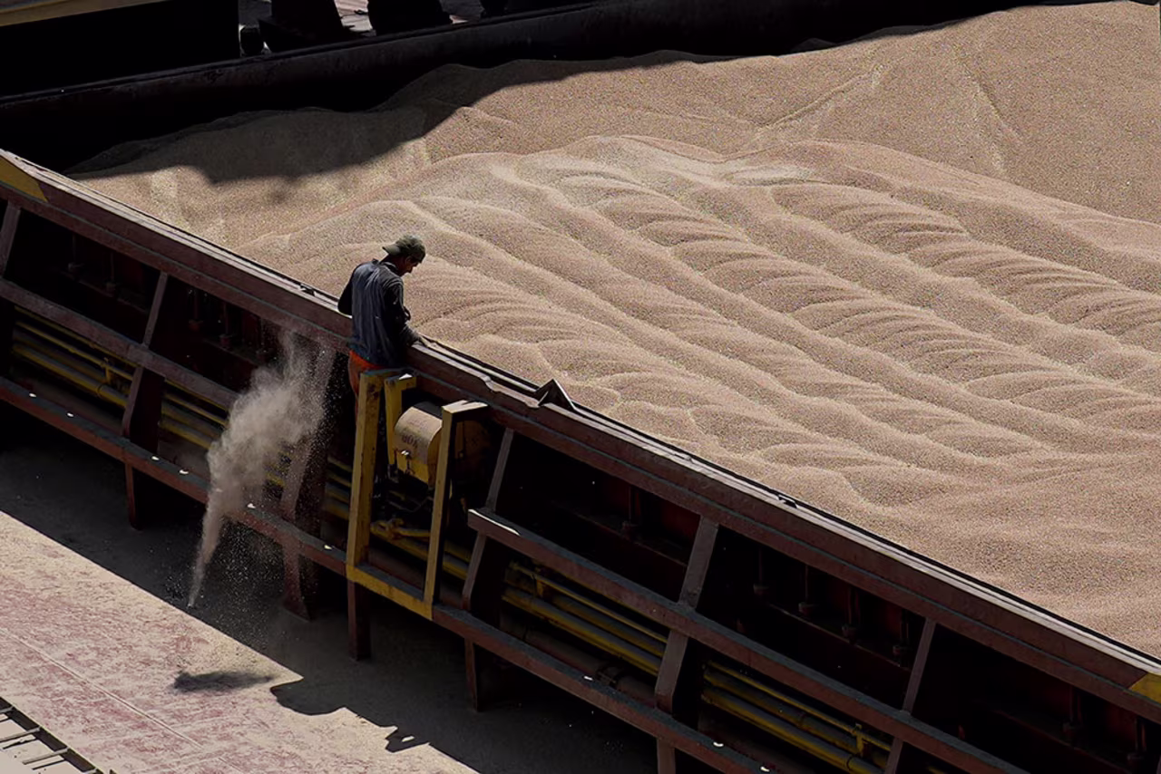 An employee of the Romanian grain handling operator Comvex oversees the unloading of a shipment from the Ukraine in the Black Sea port of Constanta, Romania, on June 21, 2022. 