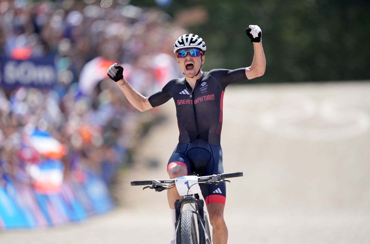 Pidcock crosses the line to win gold on Monday.