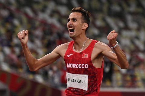 Morocco's Soufiane El Bakkali celebrates winning gold in the 3000-meter steeplechase on August 2.