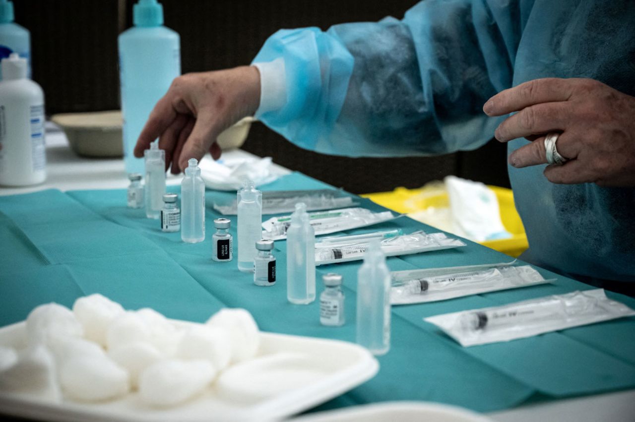 A member of the medical staff arranges the phials and syringes to prepare the different doses of the Pfizer/BioNTech Covid-19 vaccine in Lyon, France on March 29.