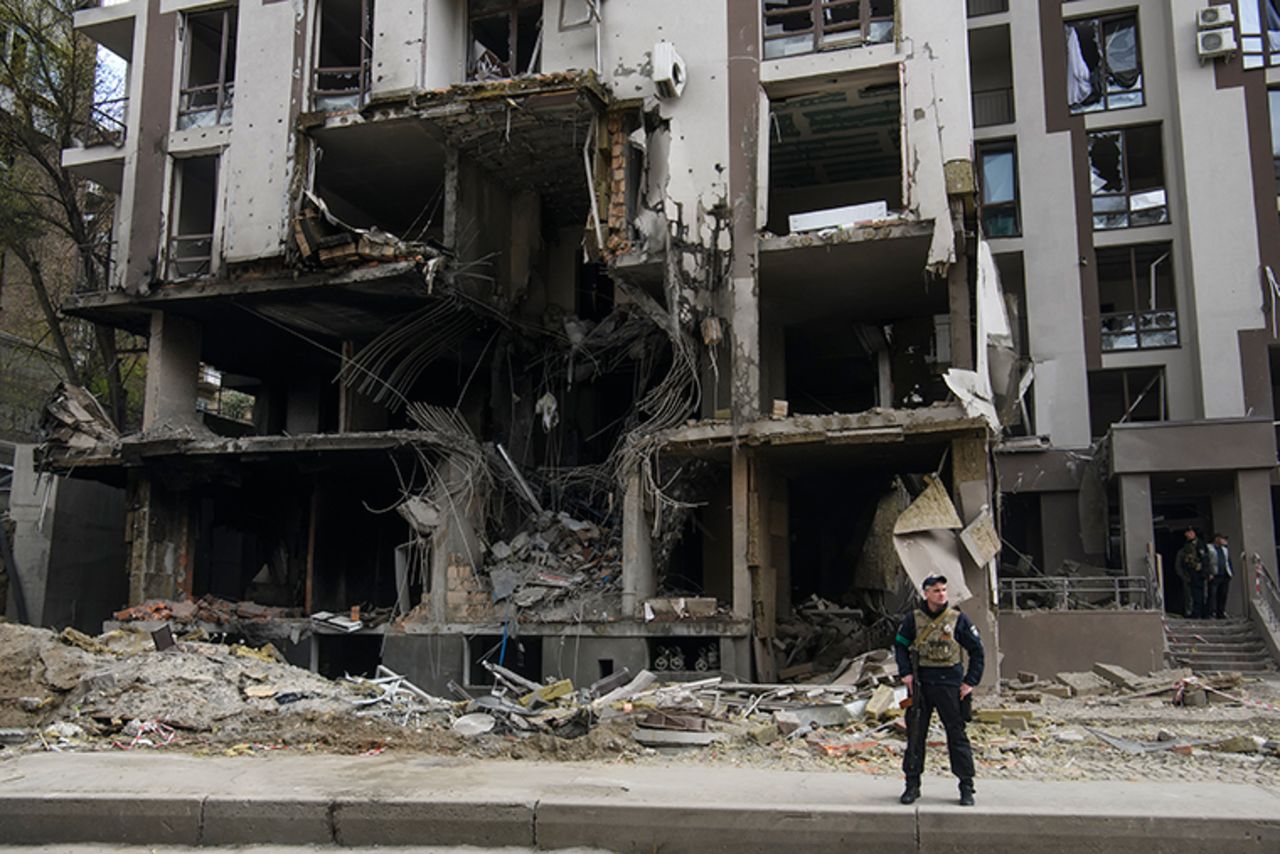 A Ukrainian serviceman stands close to the rubble of an apartment block destroyed amid Russia's invasion of Ukraine, in Kyiv, Ukraine April 29.