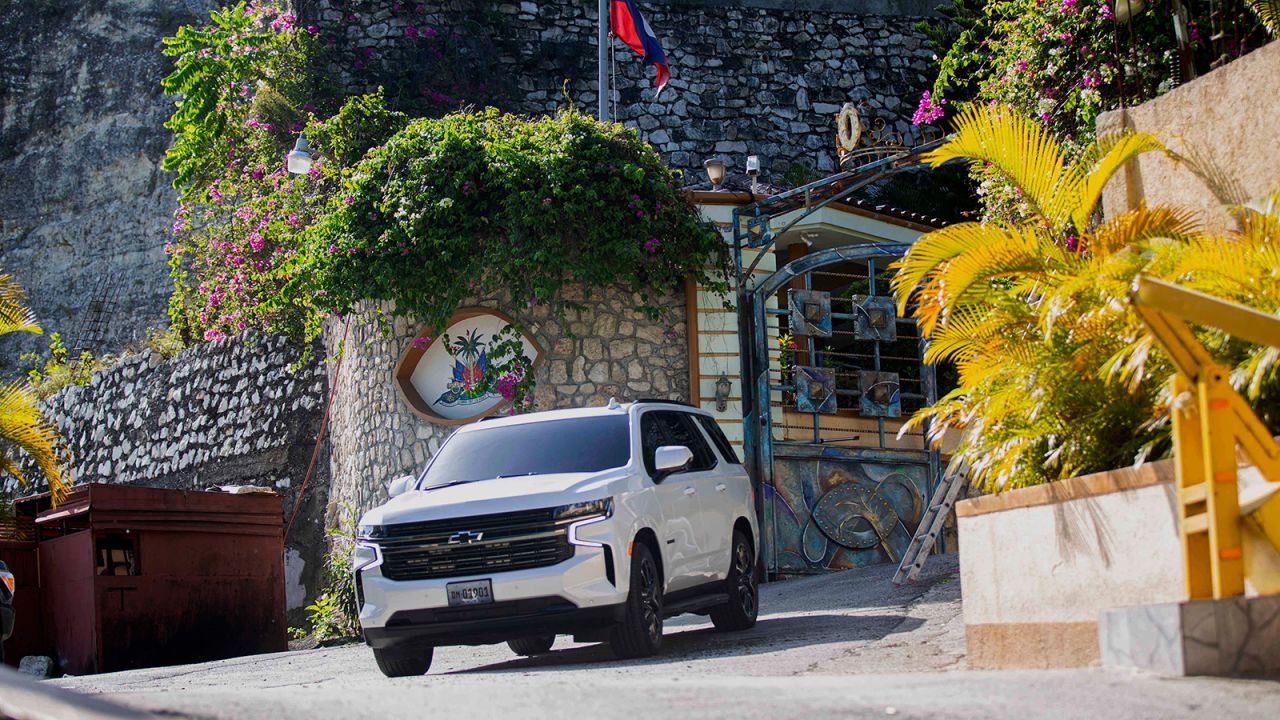 A vehicle leaves the entrance to the residence of late Haitian President Jovenel Moise in Port-au-Prince, Haiti on Wednesday.