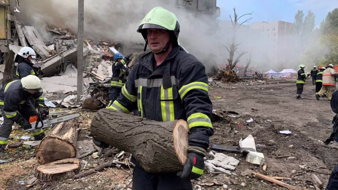 More than 200 rescuers sifted through rubble in Zaporizhzhia Sunday after Russian missile strikes.