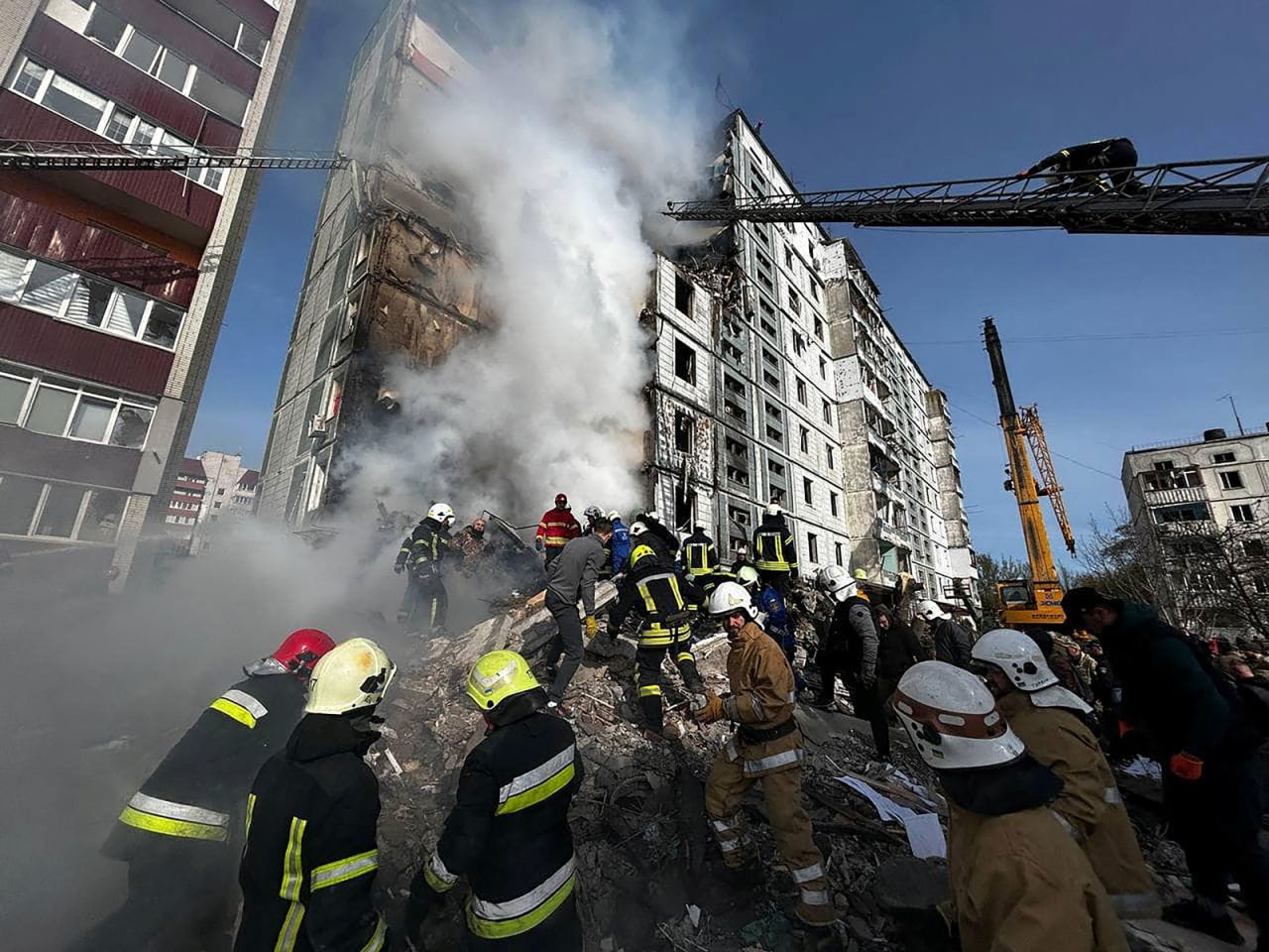Rescuers work at the site of a residential?building?heavily damaged by a Russian missile in Uman, Ukraine?on Friday, April 28. 