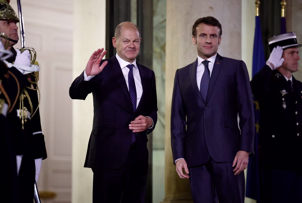 German Chancellor Olaf Scholz, left, joins French President Emmanuel Macron for a meeting at the Elysee Palace in Paris on February 8. 