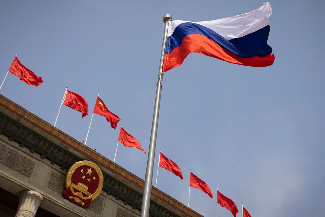 The Russian national flag flies in front of the Great Hall of the People in Beijing, China, on May 24.