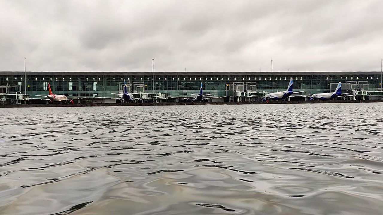 Aircrafts are parked at a terminal near the flooded tarmac at Netaji Subhas Chandra Bose International Airport after the landfall of Cyclone Amphan in Kolkata on May 21.