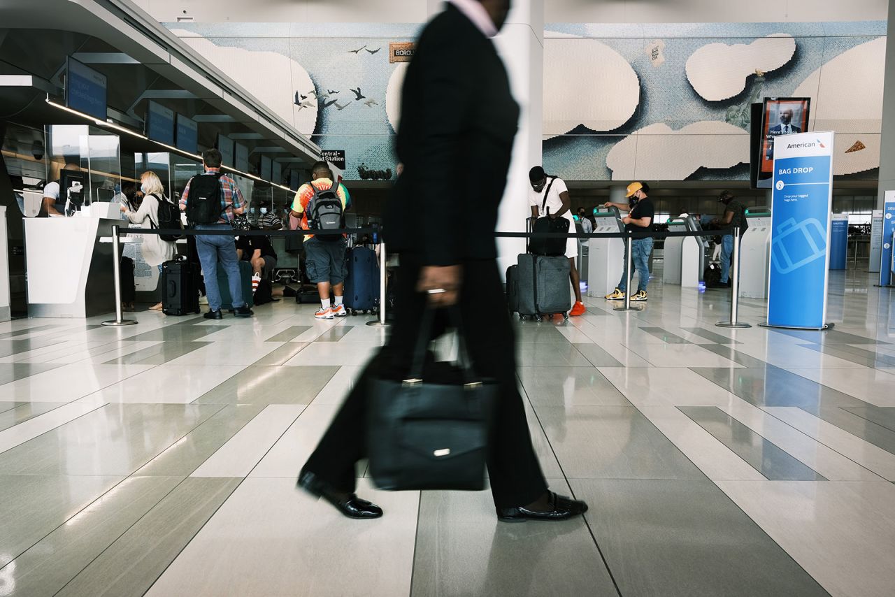 People travel through LaGuardia Airport in New York on July 2.