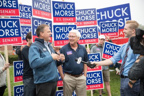 New Hampshire Gov. Chris Sununu and Chuck Morse speak to the media at a polling location on September 13 in Bedford, New Hampshire. 