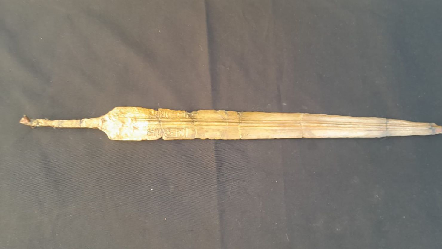 The sword is engraved with the name of Ramses II in hieroglyphics.