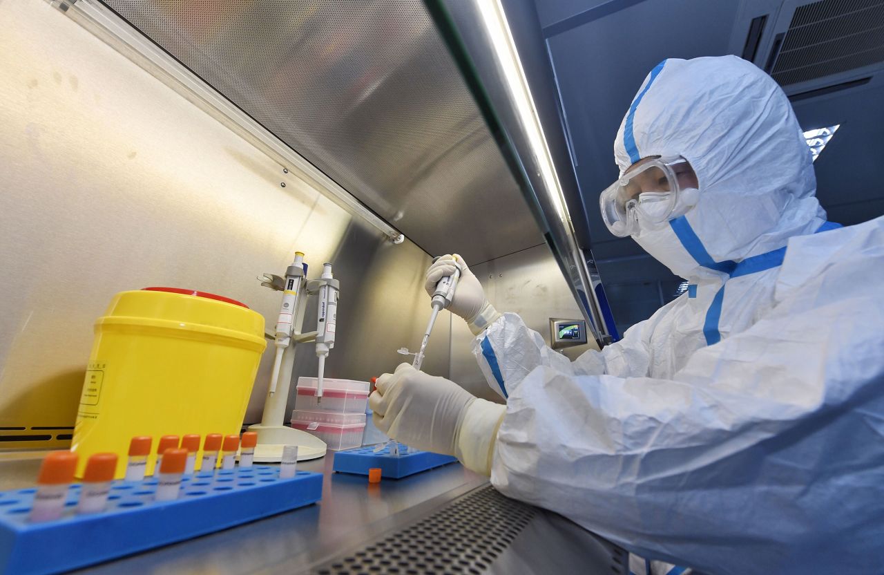 A staff member tests samples in a lab at the Sichuan International Travel Health Care Center in Sichuan, China, on February 15. Novel coronavirus nucleic acid detection for incoming and outgoing travelers has become the primary task of the laboratory.