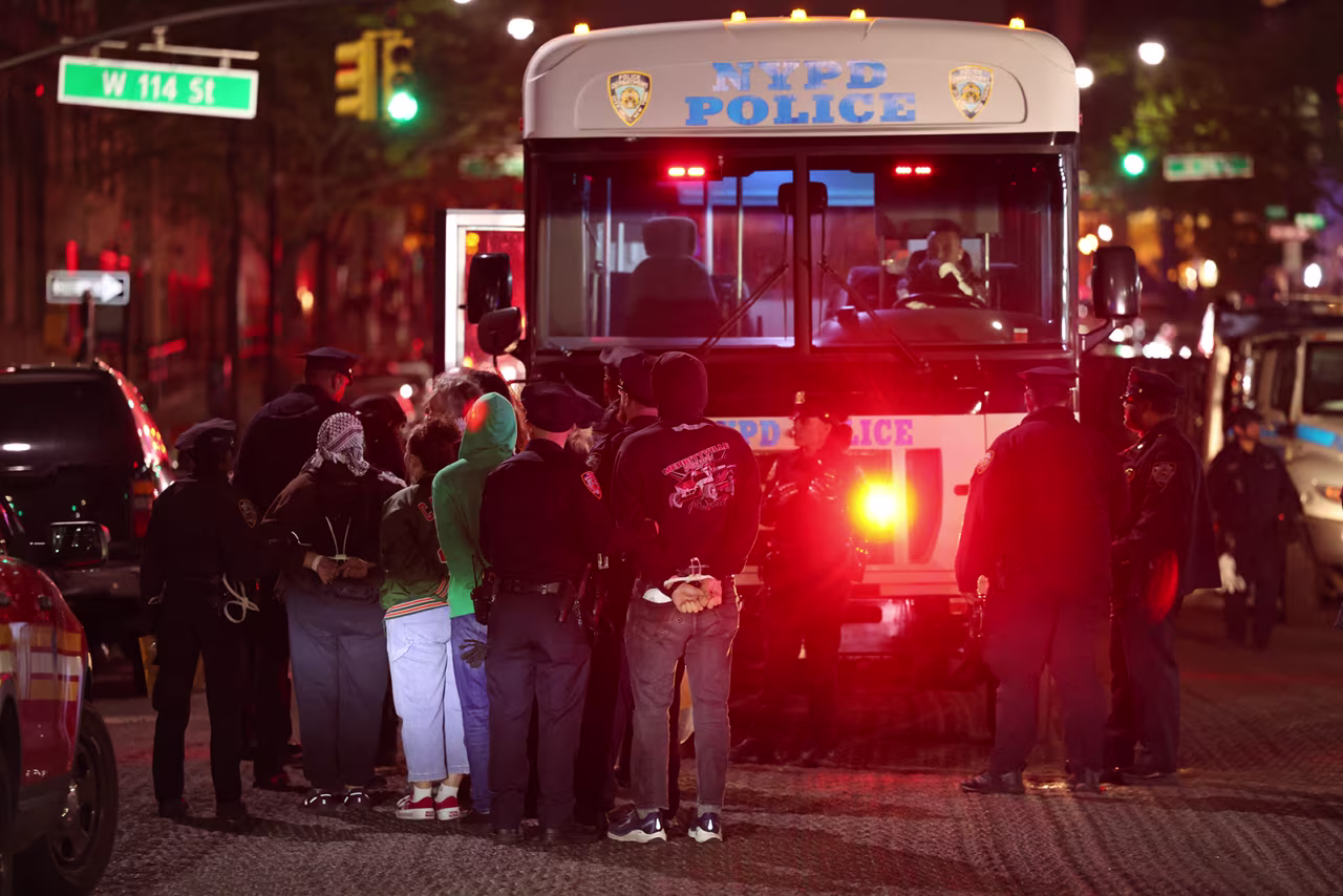 NYPD officers detain students at Columbia University in New York City on April 30.