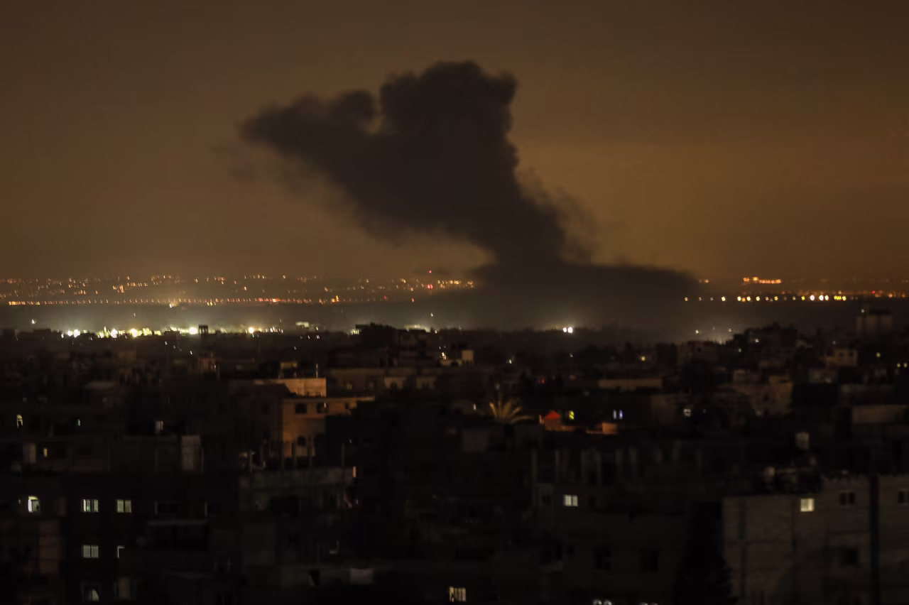 Smoke rises as a result of Israeli attacks in Khan Younis, Gaza on December 29.