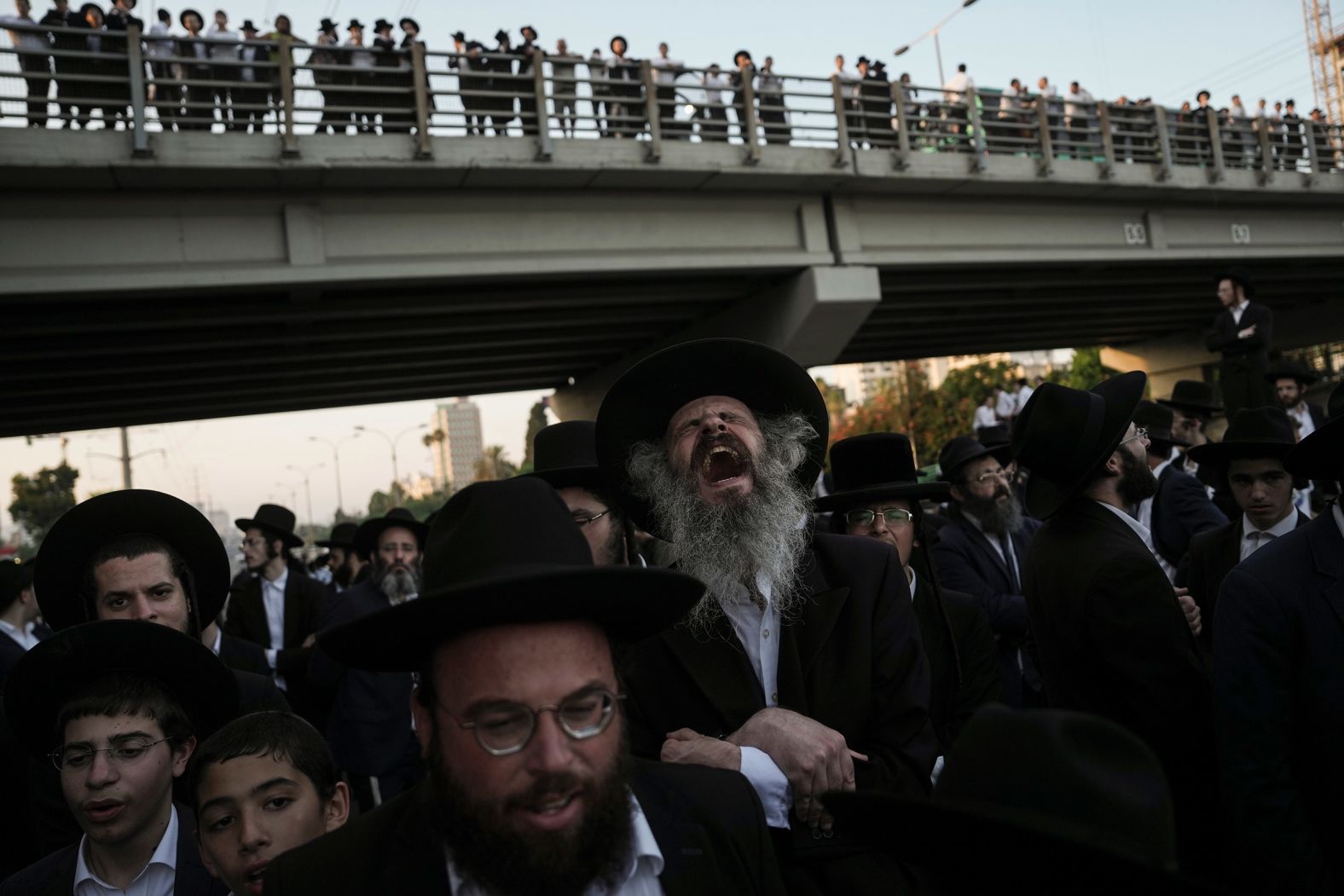 Ultra-Orthodox Jewish men block a highway during a protest in Bnei Brak, Israel, on June 27. A Supreme Court ruling on June 25 said the Israeli government <a href="https://www.cnn.com/2024/07/01/middleeast/ultra-orthodox-in-israel-defy-orders-to-serve-in-military-mime-intl/index.html">must enlist draft-age ultra-Orthodox Jews into the military</a>, reversing a de facto exemption in place since the country’s founding 76 years ago.