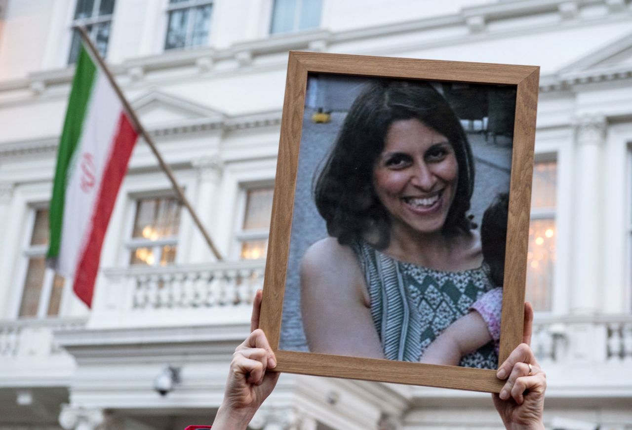 A person holds up a photo of Nazanin Zaghari-Ratcliffe during a vigil in London, England on January 16, 2017.