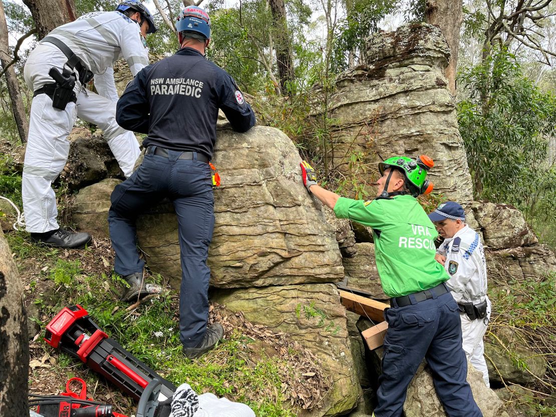 The 23-year-old was walking with friends when she dropped her phone among the rocks.