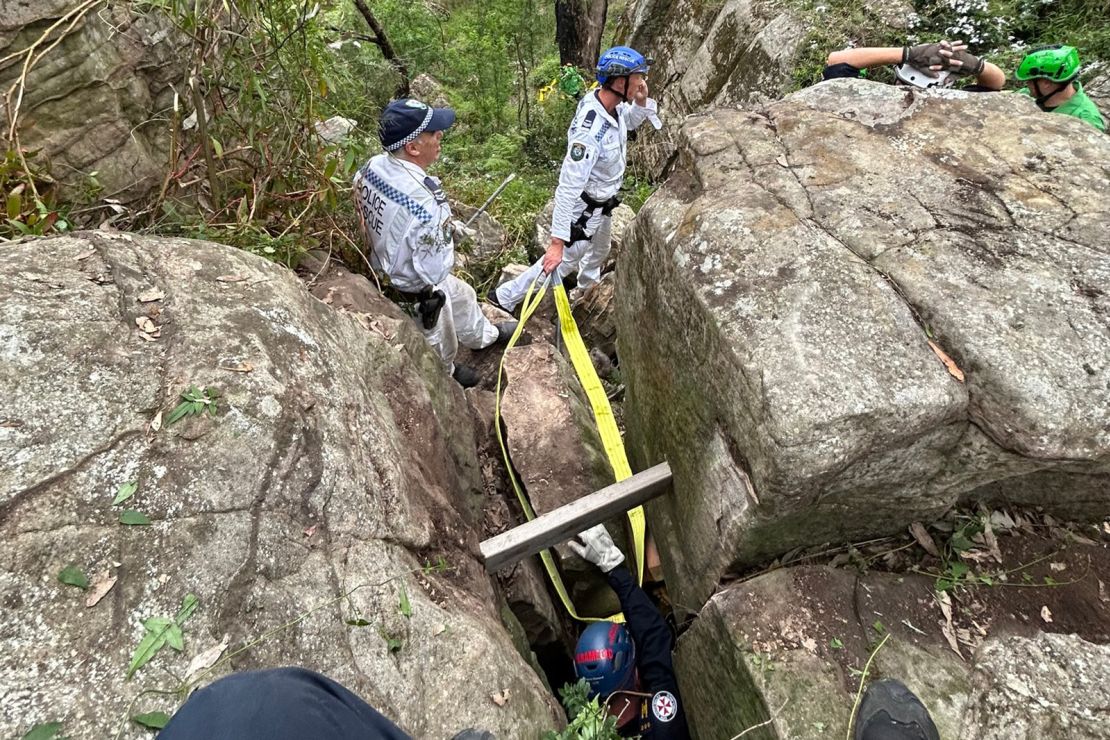 The woman was wedged between rocks near an overgrown bush track.