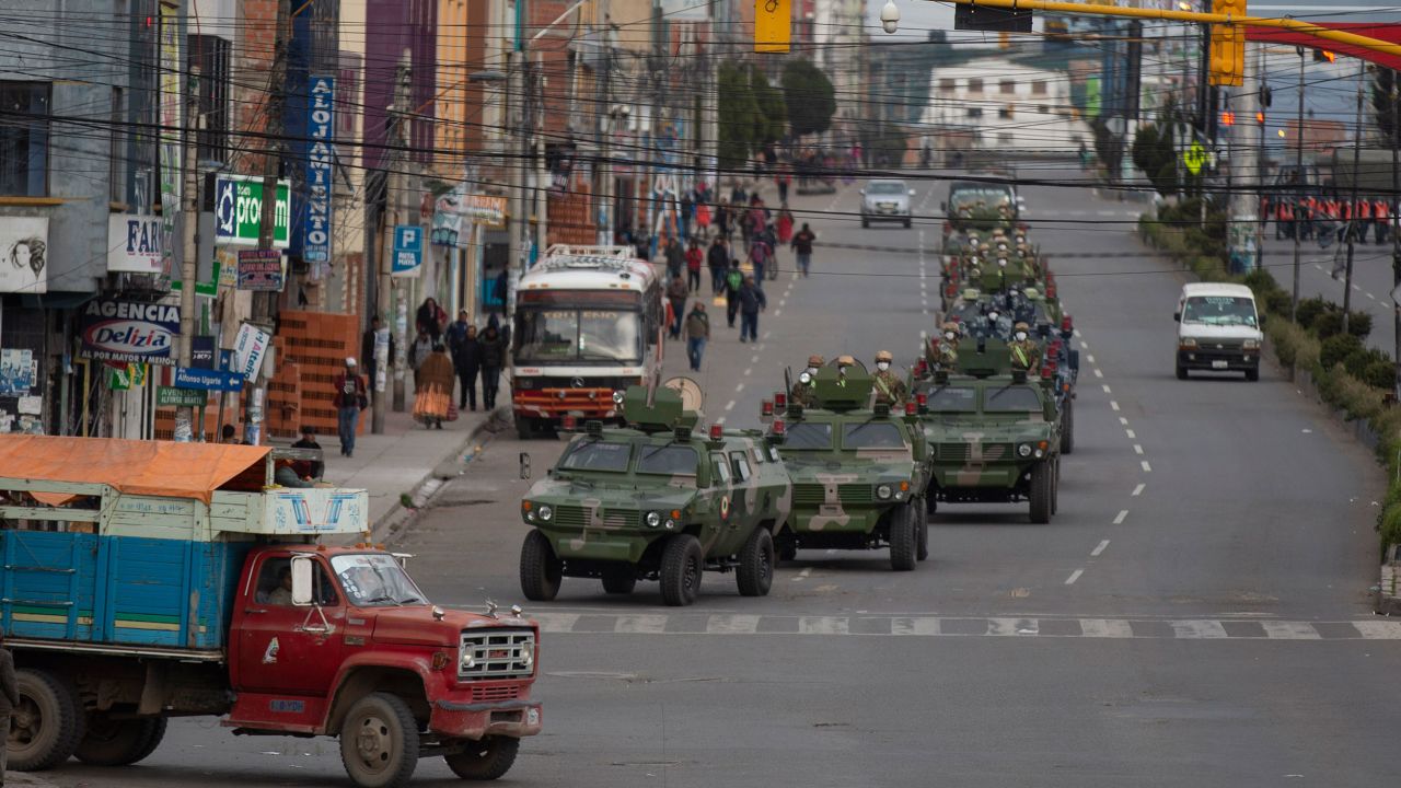 Military armored vehicles patrol the streets during a quarantine in El Alto, Bolivia, on Friday.