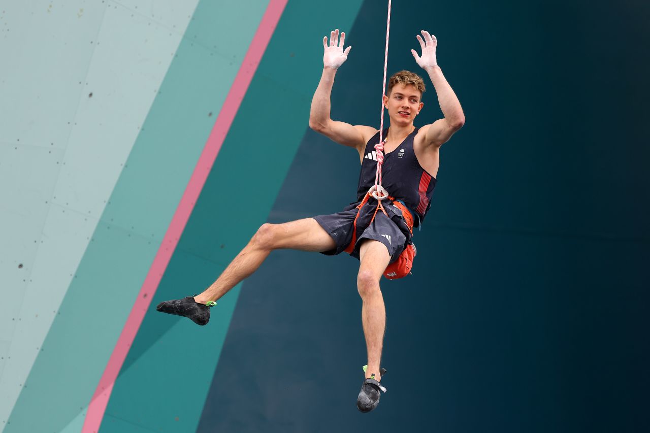 Toby Roberts of Great Britain celebrates winning gold in the men's boulder and lead climbing final on Friday. 