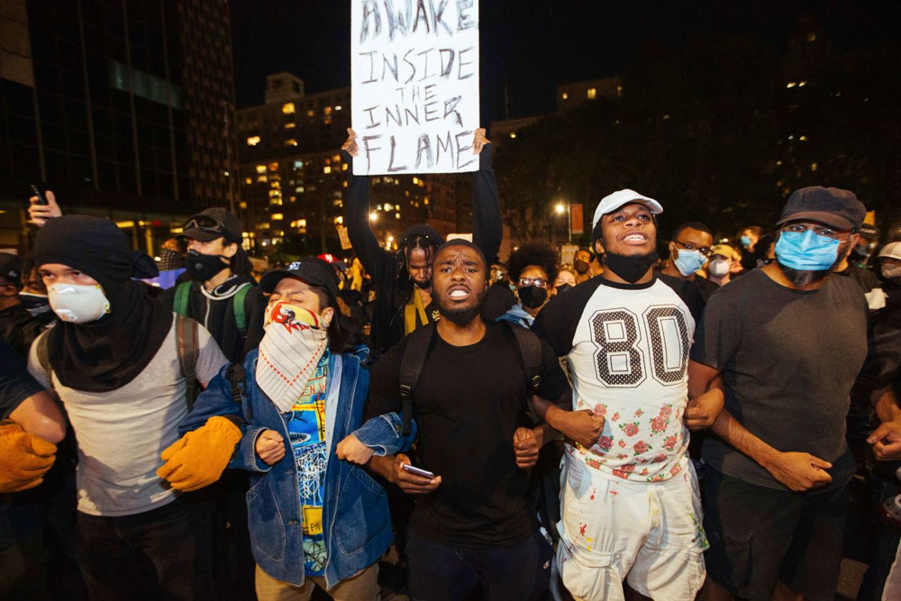 Activists march to the Brooklyn Bridge on Sunday, May 31, in New York. 