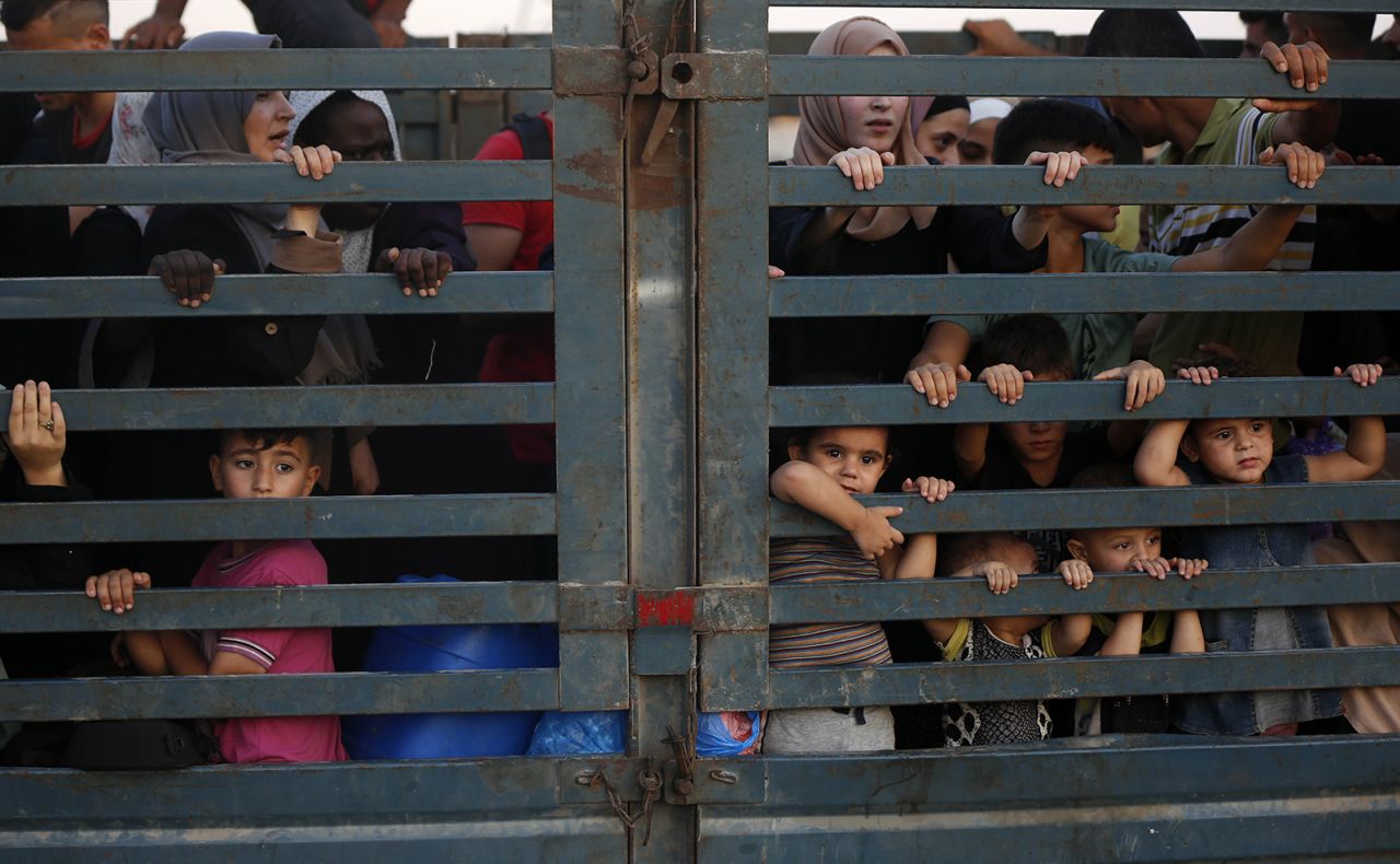 Displaced Palestinians are leaving al-Bureij refugee after the Israeli army issued a new evacuation order, in the central Gaza Strip on July 28.