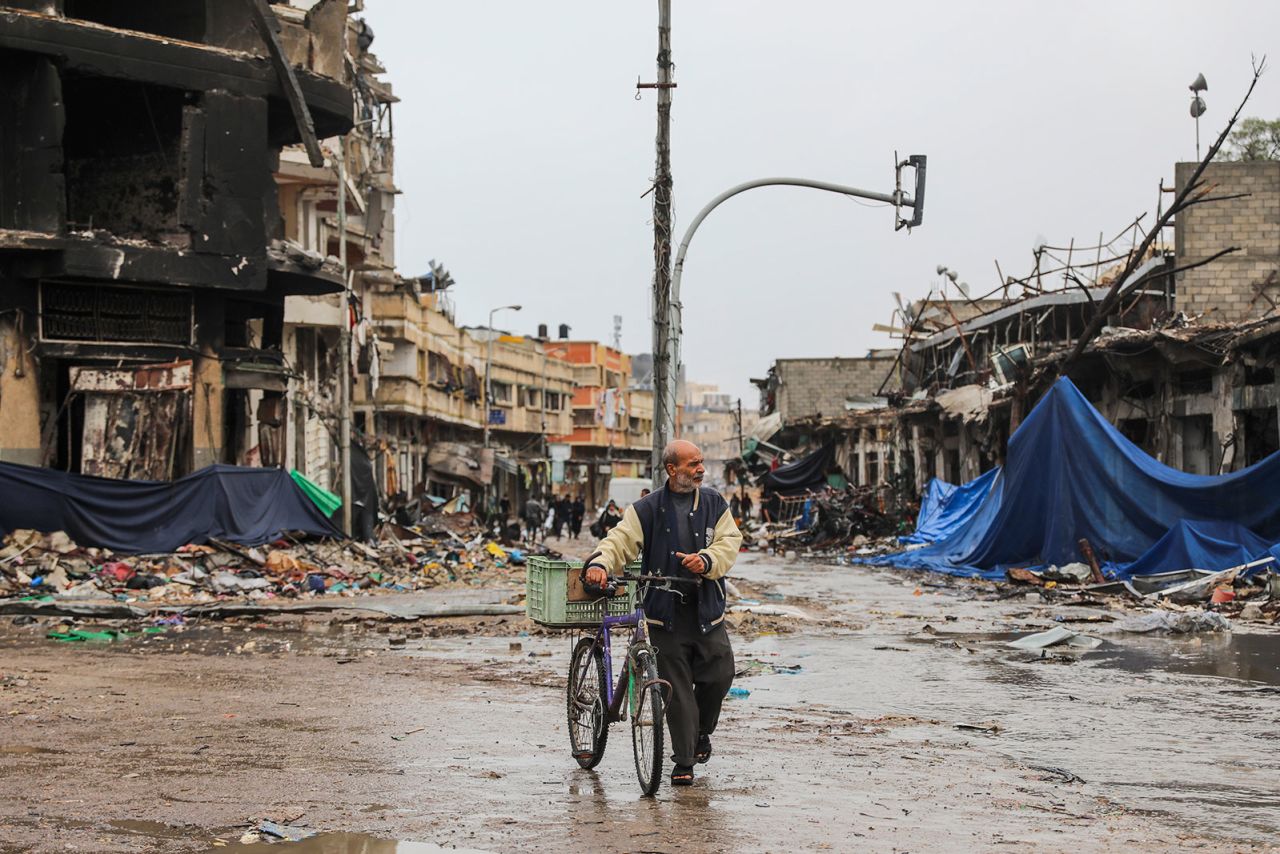 A Palestinian walks in Gaza City on Monday, November 27, on the fourth day of the temporary truce between Hamas and Israel. 