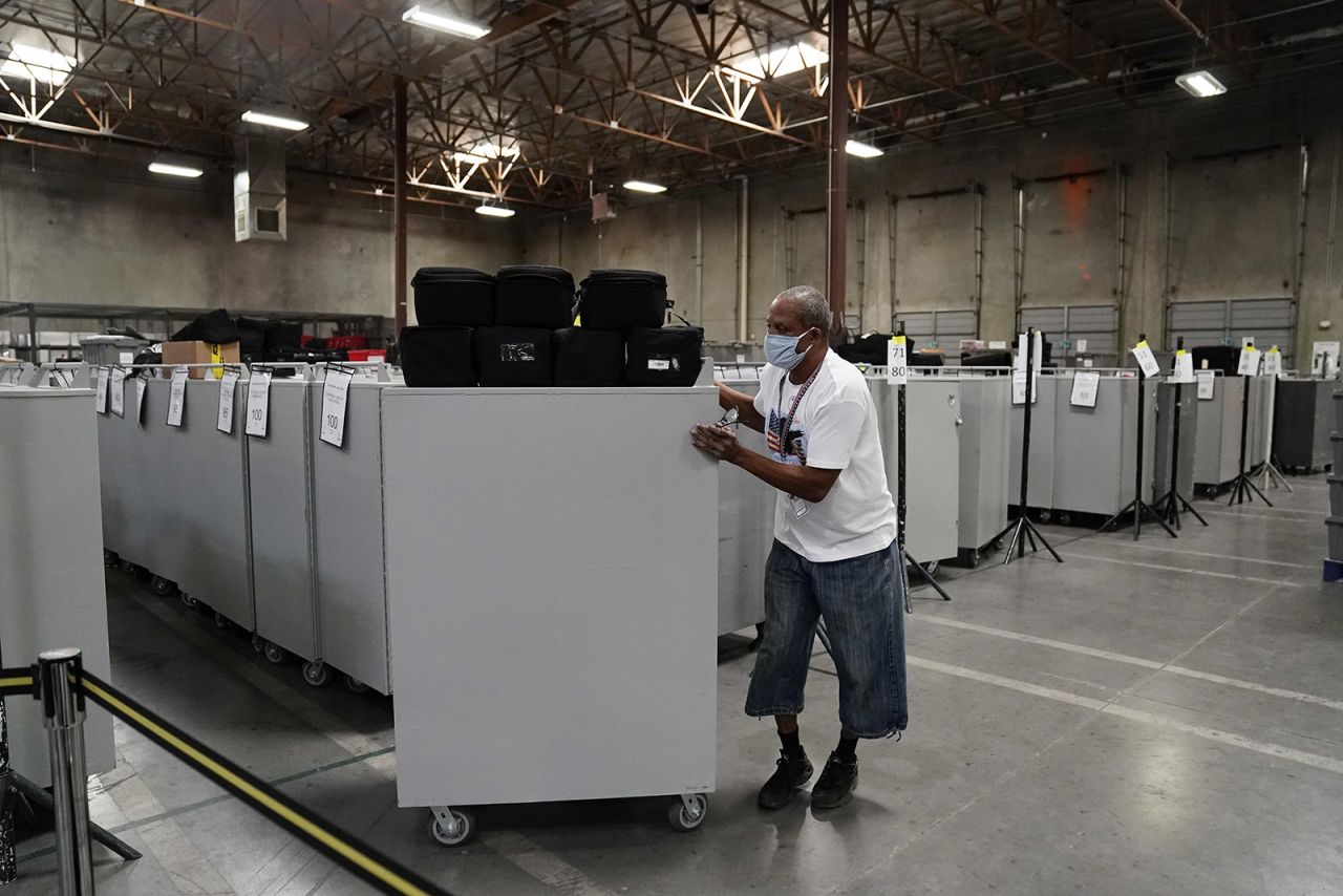 An election warehouse worker moves polling place equipment at the Clark County Election Department in North Las Vegas, Nevada on Friday. 