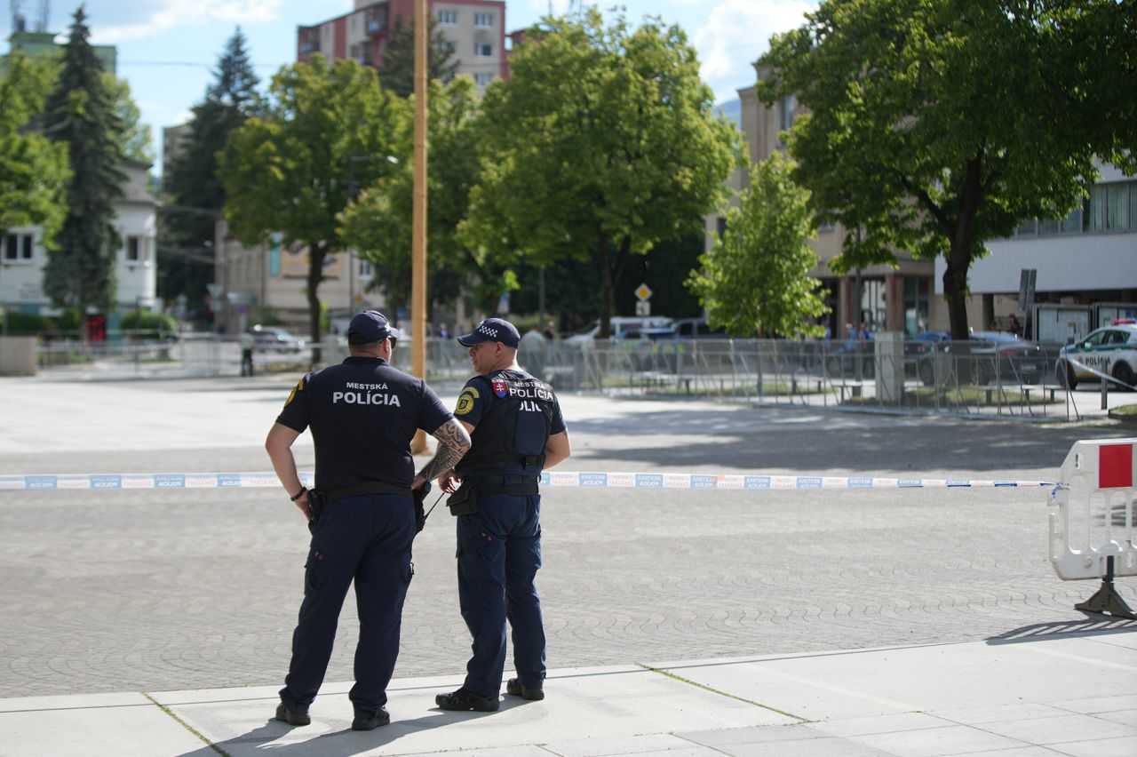 Police officers stand guard near the cordoned-off crime scene where Slovak Prime Minister Robert Fico was shot earlier in the day, in Handlova, Slovakia, on May 15.