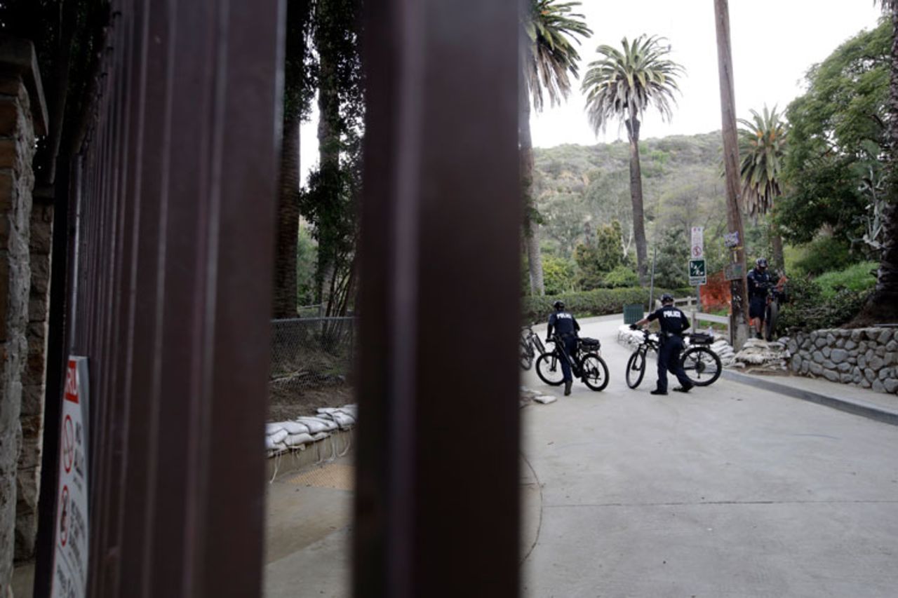 Police patrol Runyon Canyon park after it was closed to the public Wednesday, March 25, in Los Angeles.