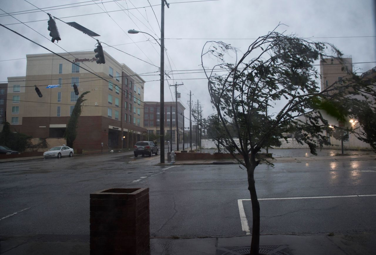 A tree bends from the heavy rain and wind from Hurricane Florence in Wilmington, North Carolina on Friday 